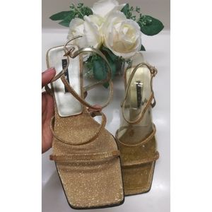 Gold strappy squared toe heels